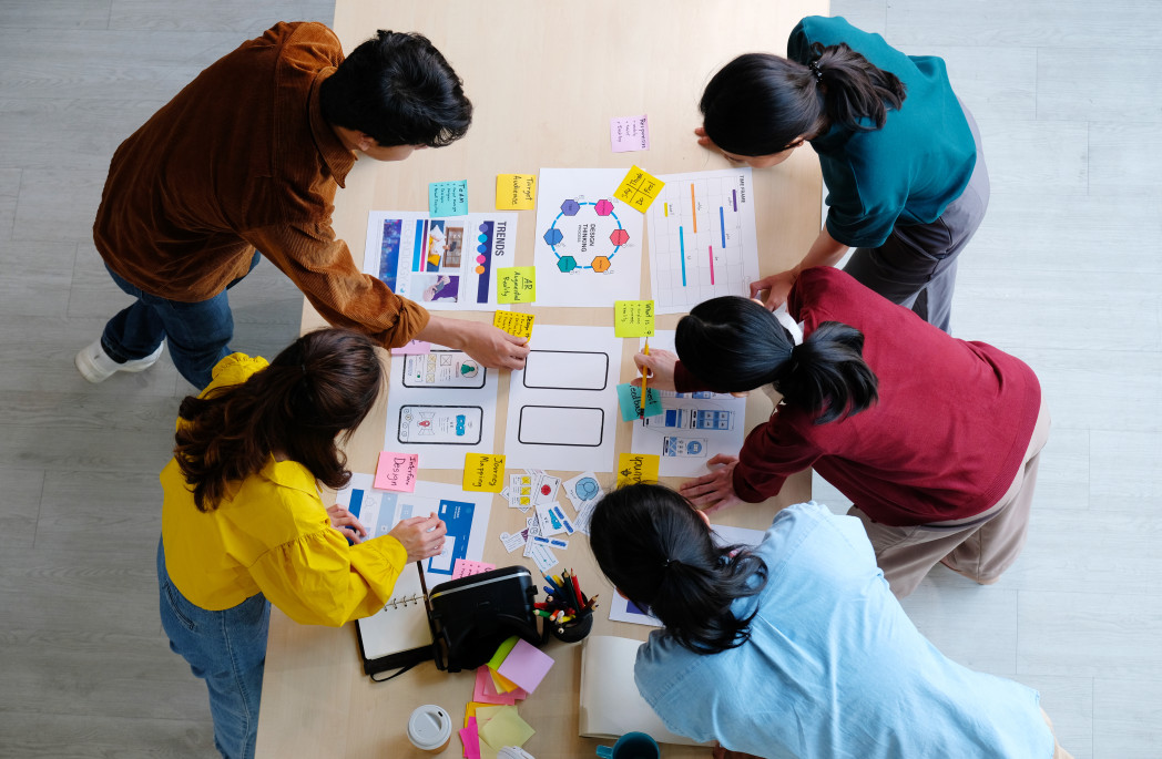 students sitting on a table for a working group